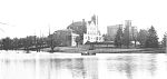 The early campus: Barker Hall in the center, the Main Building to the right, and a lake in the foreg